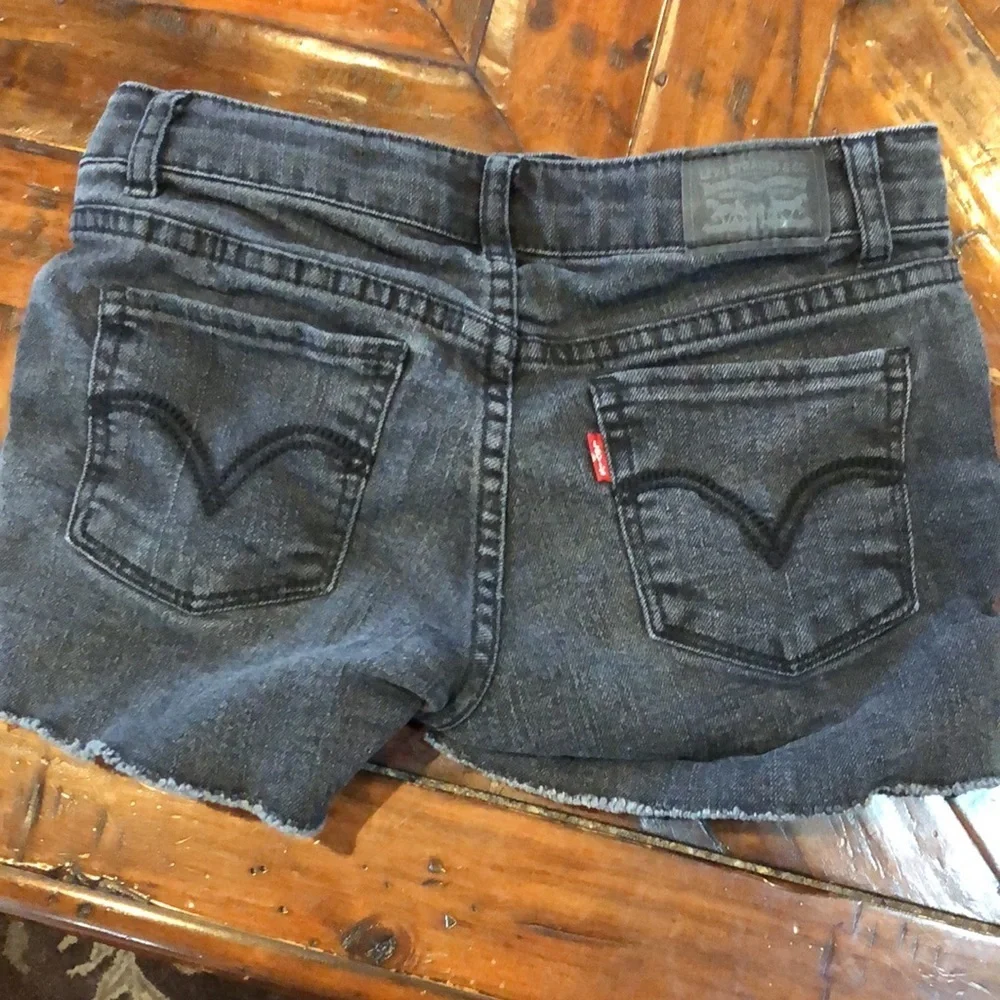 Levi’s girls black denim shorty shorts with lace up sides